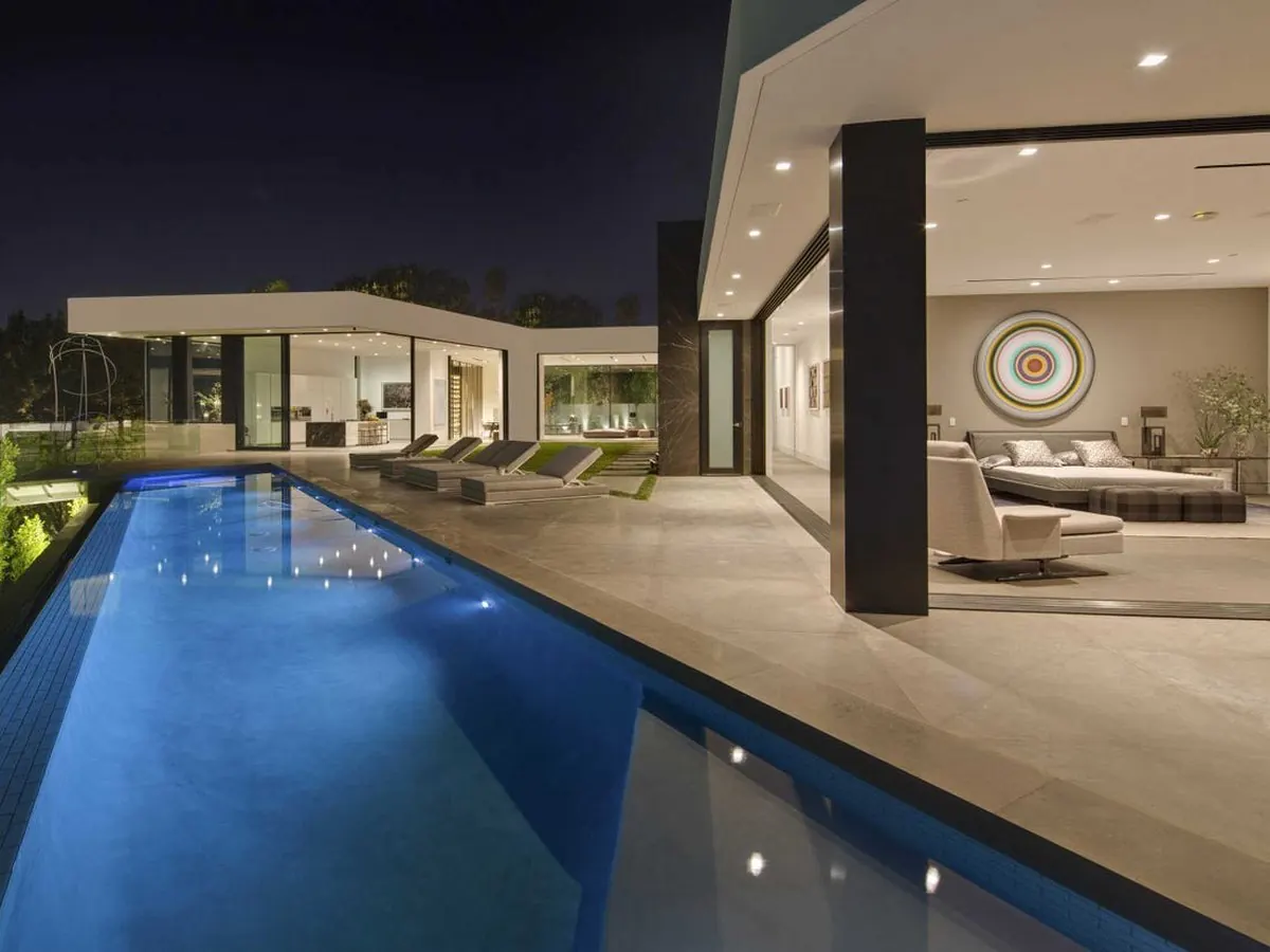 Indoor-outdoor rooftop swimming pool with panoramic city views