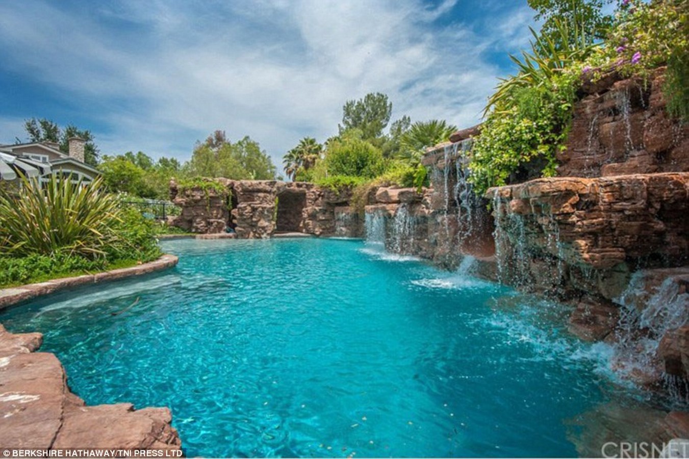 Stone canyon-inspired natural rock swimming pool